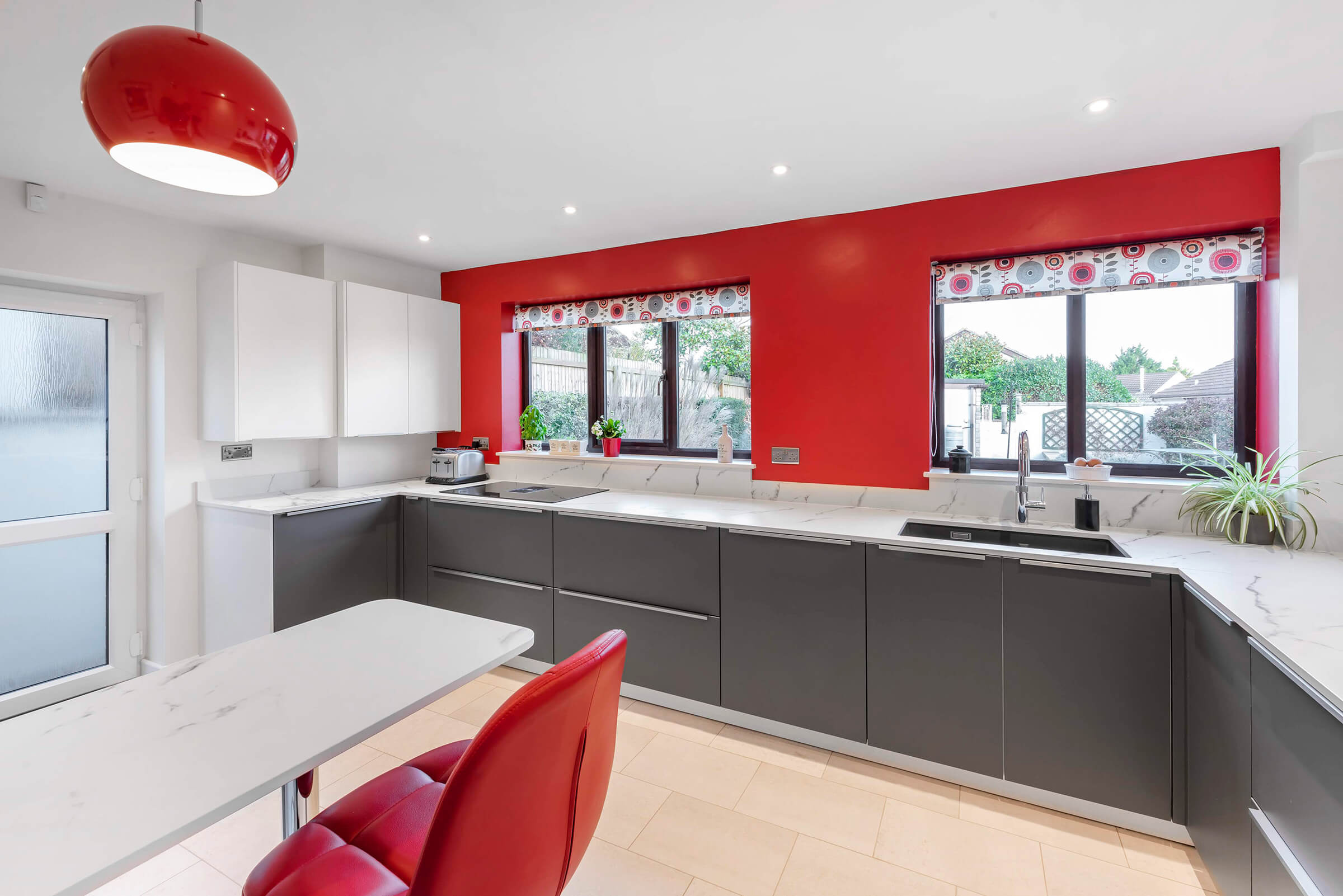 Contemporary Kitchen Design: Modern Grey and White Kitchen with Bold Red Accents
