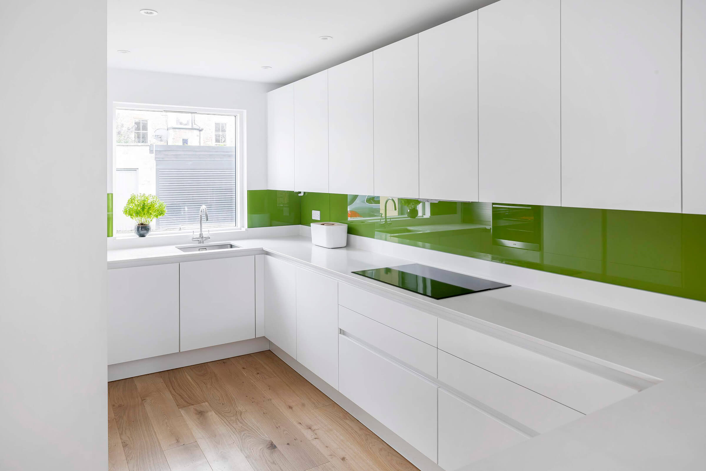 Minimalist Kitchen Design: Bright White Kitchen with Elegant White Quartz Worktop