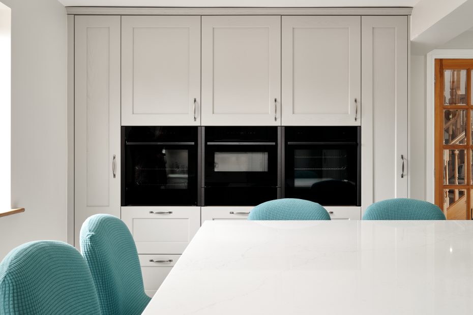 Tall kitchen cabinets with a bank of 3 ovens